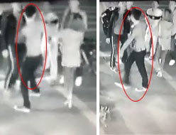 Nam thanh niên (vòng tròn đỏ) đứng ra bảo vệ bạn gái bị nhóm đối tượng đi xe máy vây đánh. (Ảnh chụp từ clip)
