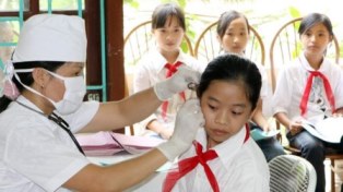 Thu bảo hiểm y tế phải được phụ huynh đồng thuận