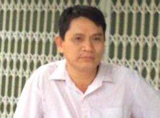 Dũng tại cơ quan công an. 