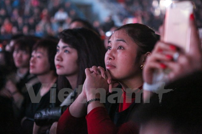 Có người lặng đi. (Ảnh: Minh Sơn/Vietnam+)