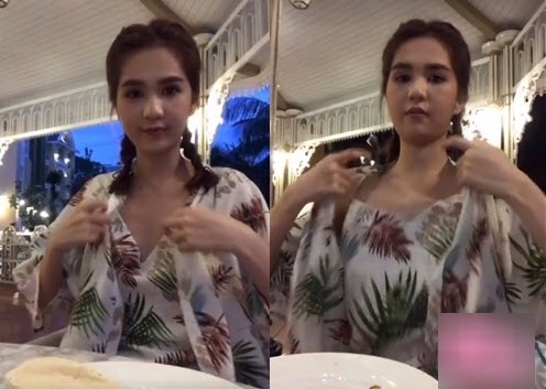 Thỉnh thoảng Ngọc Trinh lại quay ra chỉnh lại trang phục.