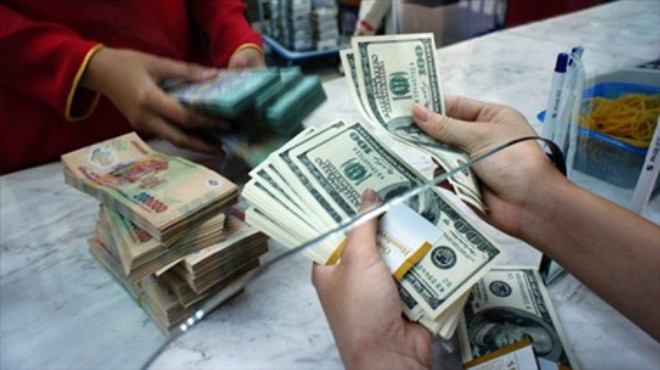 Hiện tỷ giá VND/USD tại các NHTM và trên thị trường tự do ổn định. Ảnh minh họa