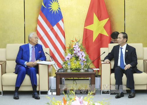 Chủ tịch nước Trần Đại Quang gặp song phương Thủ tướng Malaysia. Ảnh TTXVN 